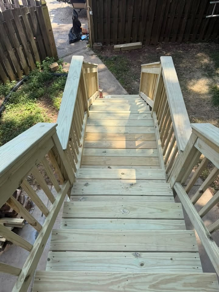 Top-down view of new wooden deck stairs during construction